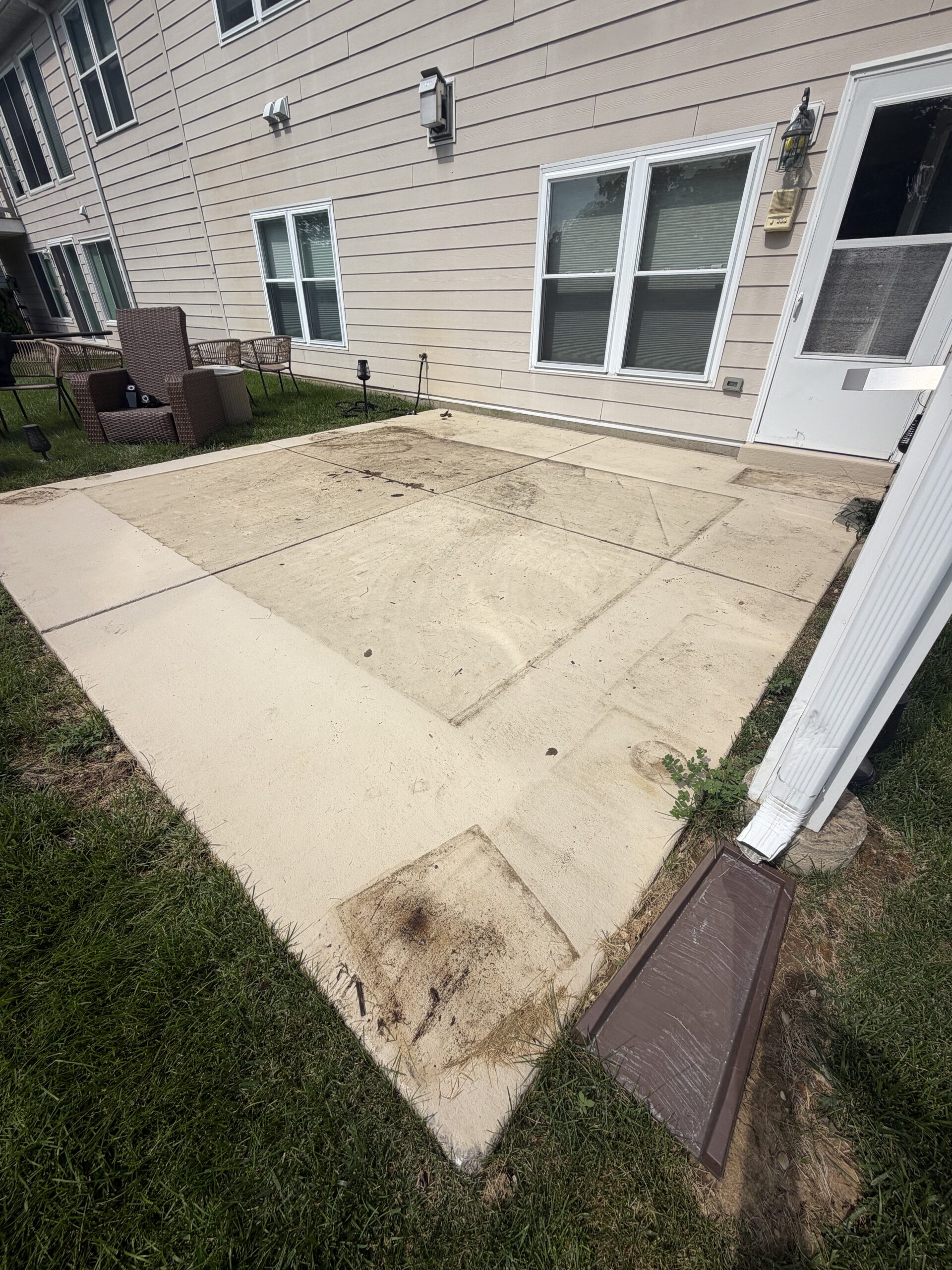 Limitless Exterior Cleaning concrete surface before professional cleaning