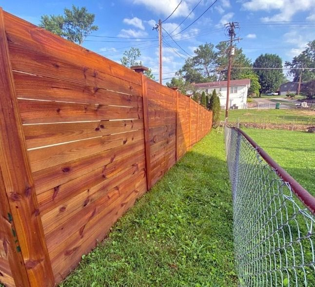 Fence and Deck Staining on an outdoor wood fence